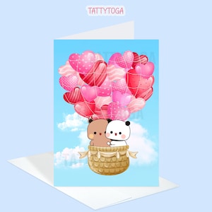 May include: A greeting card featuring a cartoon bear and panda holding onto a hot air balloon made of pink and red hearts. The card has a blue background with white clouds.