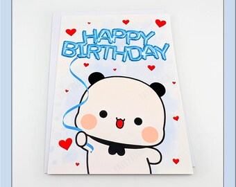 May include: A birthday card featuring a cartoon panda with black ears and a black bow tie. The card has the words "HAPPY BIRTHDAY" in blue, with red hearts scattered around the panda. A blue ribbon extends from the text.