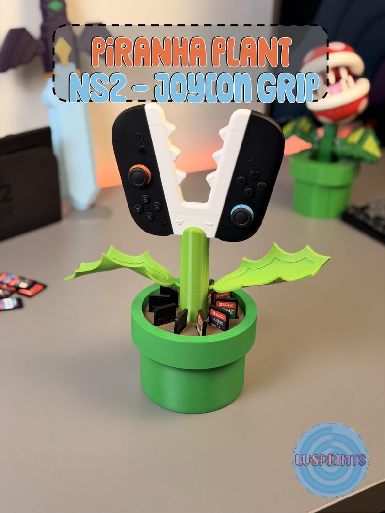 May include: A green Piranha Plant-themed NS2 Joy-Con grip, with a white and black controller design. The grip is in a green pot, with game cartridges inside. The text "Piranha Plant NS2 - Joycon Grip" is visible.