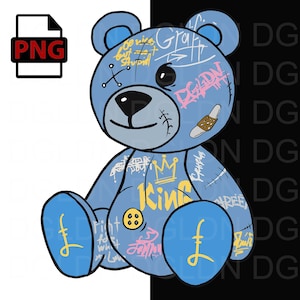 May include: A blue teddy bear with stitched seams and graffiti-style markings. The bear is wearing a crown and the word "King" is written on its chest. The bear is sitting with its legs crossed and has a button on its belly.