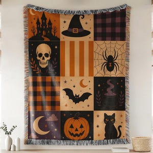 May include: A woven throw blanket featuring a grid of nine Halloween-themed panels. Designs include a haunted castle, witch hat, plaid patterns, a skull, a spider web, a bat, a cauldron, a crescent moon, a jack-o'-lantern, and a black cat.