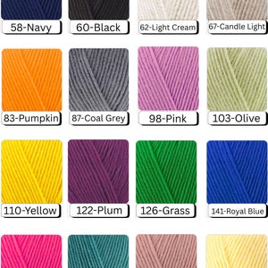 May include: A collection of yarn skeins in various colors, including navy, black, cream, and gray. Other colors include pumpkin, pink, olive, yellow, plum, grass, royal blue, fuschia, teal, powder, and light yellow. Each skein is labeled with a number and color name.