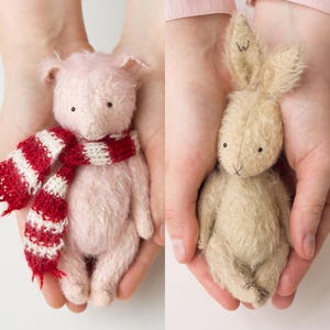 May include: Two handmade plush toys, a pink pig wearing a red and white striped scarf and a beige bunny rabbit.