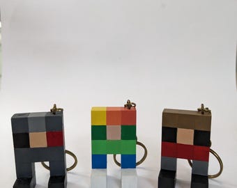 Hermitcraft and Guess the build-Inspired Wooden Keyrings – Handmade & Hand-Painted