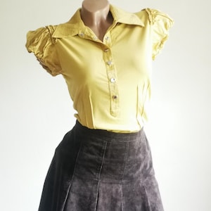 Office Coquette Blouse from Karen Millen. Flirty blouse with silk puff sleeves.