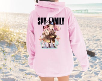 Sudadera con capucha unisex Heavy Blend™ Anya Damian / Sudadera con capucha de la familia Spyx con diseño en la parte delantera y trasera