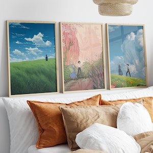 May include: Three framed prints of anime-style artwork depicting couples in nature. The first print shows a couple walking on a grassy hill with a blue sky and clouds. The second print shows a couple standing in a forest with pink flowers and a waterfall. The third print shows a couple walking on a grassy hill with a blue sky and clouds.