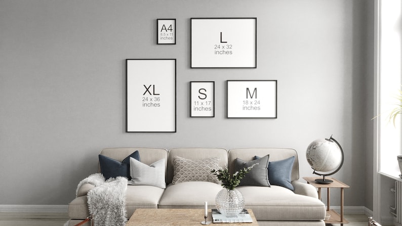 May include: A wall with five black picture frames of different sizes. The frames are labeled with the letters A4, L, XL, S, and M. The frames are hanging on a light gray wall. The text inside the frames indicates the size of the prints in inches.