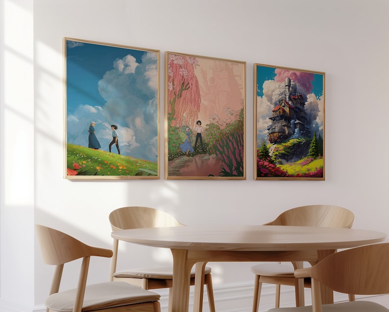 May include: Three framed art prints with a white background. The first print features a blue sky with a white cloud and two figures walking in a field of flowers. The second print features a pink and green landscape with a figure walking in a field of flowers. The third print features a whimsical, colorful building with a cloud and smoke coming from the chimney.