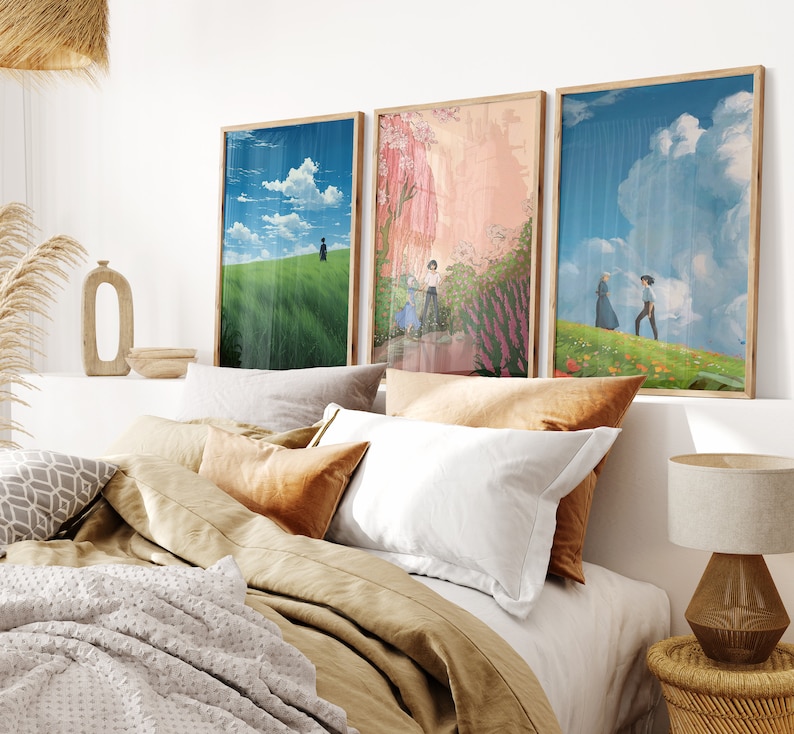 May include: Three framed art prints with a bedroom setting in the background. The prints feature a green field with a person walking, a pink and green landscape with people walking, and a blue sky with clouds and two people walking in a field.