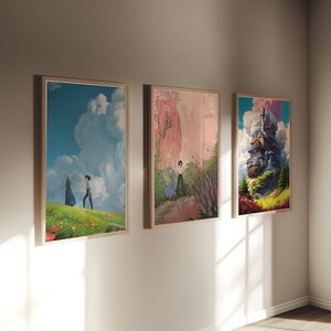 May include: Three framed art prints on a white wall. The left print shows a couple walking in a field of flowers. The middle print shows a pink and green landscape with a figure in the distance. The right print shows a floating house in the clouds.