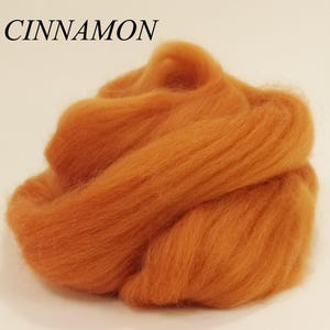 May include: A pile of cinnamon colored wool roving.