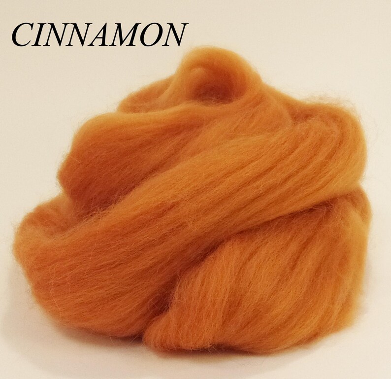 May include: A pile of cinnamon colored wool roving.