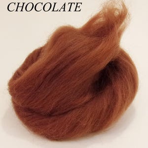 May include: A close-up of a bundle of brown wool roving, labeled "CHOCOLATE".