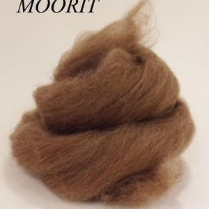 May include: A pile of brown wool roving, a type of fiber used for spinning yarn or felting.