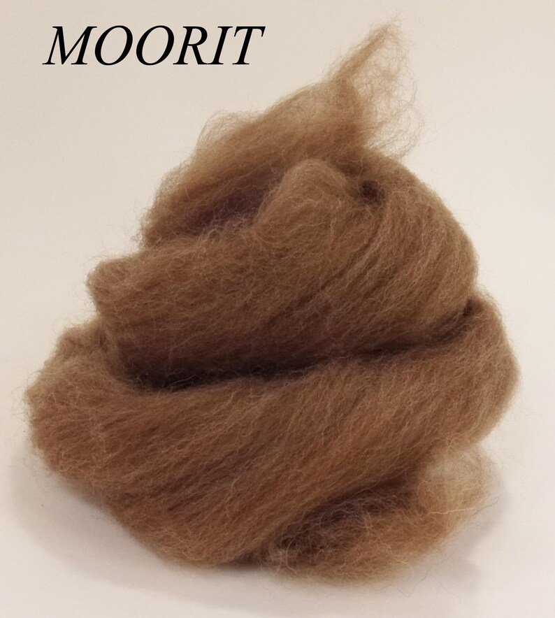 May include: A pile of brown wool roving, a type of fiber used for spinning yarn or felting.