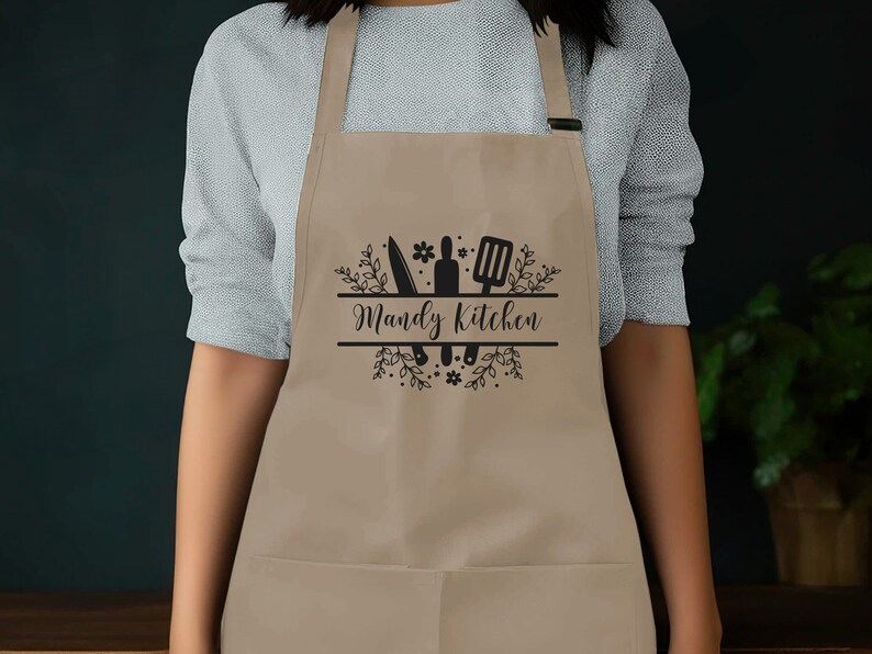 a woman wearing an apron with the words wendy's kitchen on it