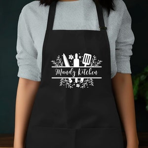 a woman wearing an apron with the words wendy's kitchen on it