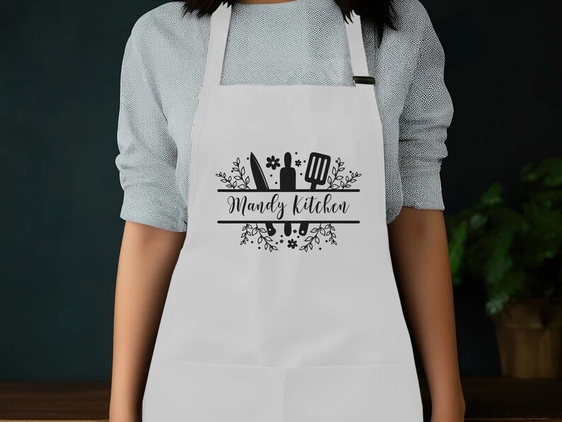a woman wearing an apron with the words randy's kitchen on it
