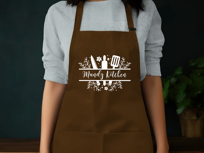 a woman wearing an apron with the words wendy's kitchen on it