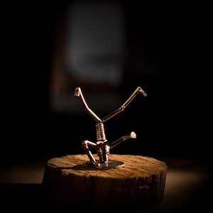 Welded Scrap Metal Breakdancer Sculpture - Car Spark Plug Art