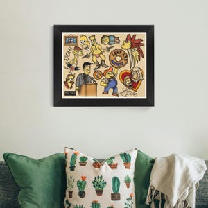 May include: A framed print featuring colorful cartoon characters in a tattoo-style design. The artwork includes images of a donut, a heart with the word "Love", and the word "Doh!". The print is displayed on a wall above a green pillow.
