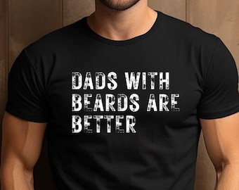 May include: A black t-shirt with the text "Dads with Beards are Better" printed in white on the front.