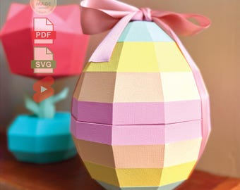 Könnte beinhalten: Eine geometrische Ostereierbox in Pastellfarben mit einem rosa Band. Die Box ist aus Papier und hat ein mehrschichtiges Design. Das Bild enthält den Text "Digitaler Dateidownload Kein physisches Produkt".
