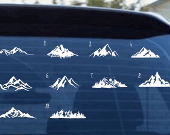 May include: White mountain range decals in various designs, numbered 1 through 10. Each decal depicts a different mountain silhouette, suitable for car windows or other surfaces. The decals are displayed on a dark blue background.