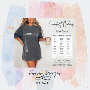May include: A dark grey unisex tee shirt with a size chart and the text "Comfort Colors". The size chart shows measurements in inches. The shirt is from Forever Designs by S&G.