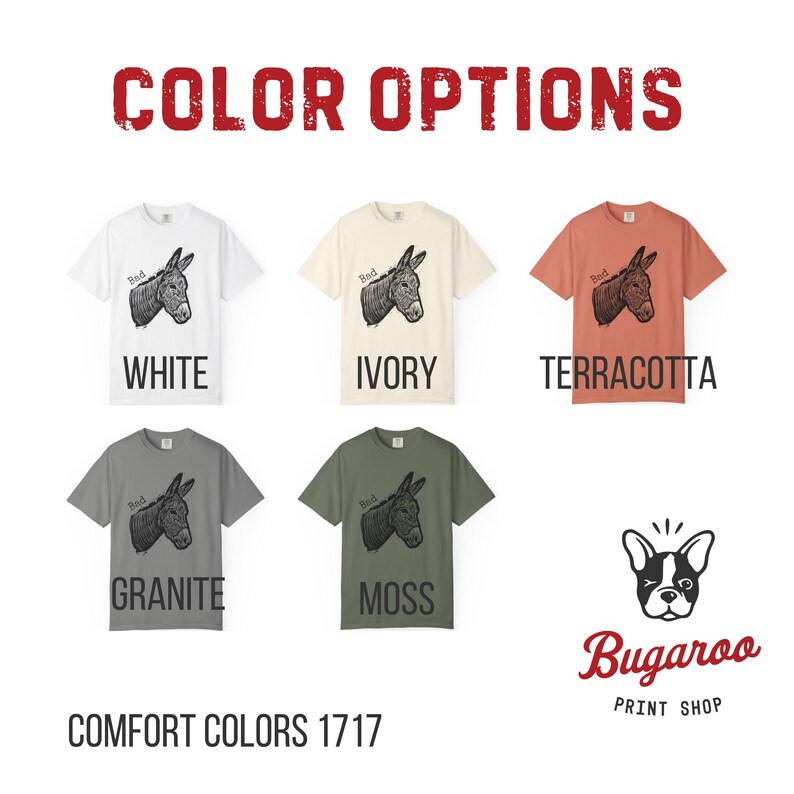 May include: A selection of t-shirts in various colors, including white, ivory, terracotta, granite, and moss. Each shirt features a donkey graphic and the word "Bed". The text "COLOR OPTIONS" and "COMFORT COLORS 1717" are also visible.