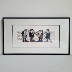 May include: Framed print depicting four musicians in medieval clothing playing brass instruments. The illustration is set against a backdrop of musical notation. The artwork is presented in a black rectangular frame, suitable for wall display.