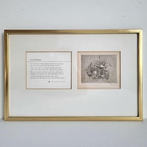 May include: A gold-framed artwork with two sections: a poem titled "Four Seasons" and a small black and white illustration. The frame is gold-coloured, and the artwork is displayed on a white background. The illustration depicts a detailed nature scene.
