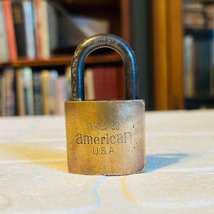Vintage American Lock Company Junkunc Bros USA Brass Padlock With Original Key Circa early 20th century in working condition.