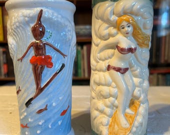 Two different Trader Dick's Surfer Girl mugs 60s thru the 80s, Vintage Tiki Mugs. Made for John Ascuaga's Hotel Casino, Reno, Nevada.