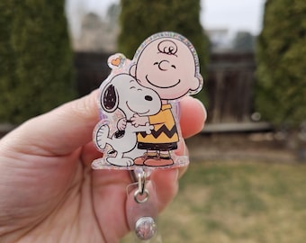 Snoopy and CB badge reel. Retractable. Matching bead charm.