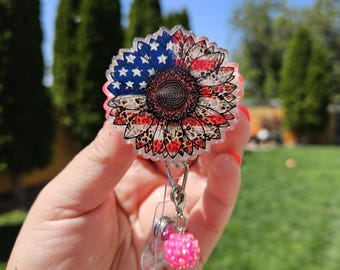 Patriotic sunflower badge reel. Holographic glitter. Matching bead charm.