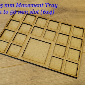 May include: Wooden movement tray with 24 compartments, each measuring 20 mm to 25 mm. The tray has a larger compartment in the centre, measuring 40 mm to 50 mm. The tray is made of light brown wood and has a dark brown border.