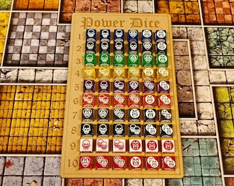 May include: A rectangular wooden board labeled Power Dice with numbers one through ten along the left side. It holds sixty small, multi-colored dice arranged in rows, each featuring various white skull and shield graphic icons on their faces.