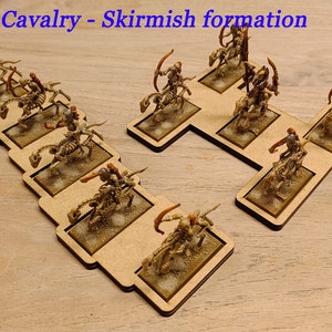May include: A set of miniature skeletal cavalry figures in a skirmish formation on wooden bases. The figures are painted in shades of brown and gold, and they are holding bows and arrows. The text "Light Cavalry - Skirmish formation" is printed at the top of the image.
