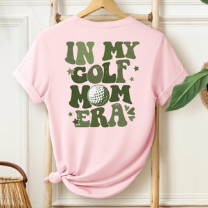 a pink shirt that says in my golf mom era