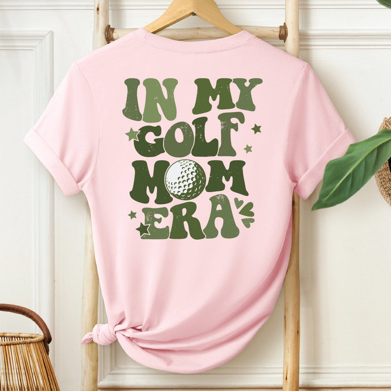 a pink shirt that says in my golf mom era