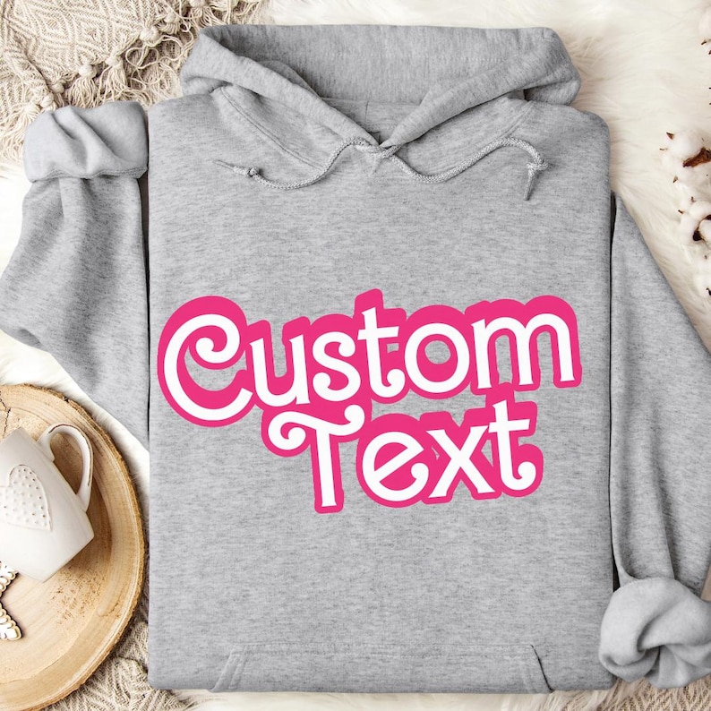 a gray hoodie with the words custom text on it