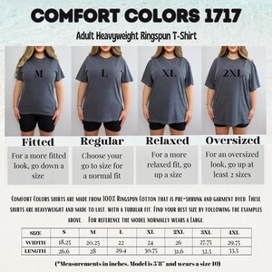 The image is a collage of four images showing different sizes of adult heavyweight ringspun t-shirts. The images depict a woman wearing each size, and the text provides information about the sizes and the comfort colors of the t-shirts.