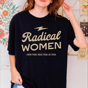 a woman wearing a black radical women t - shirt