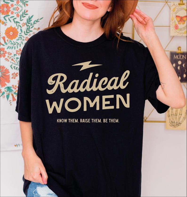 a woman wearing a black radical women t - shirt