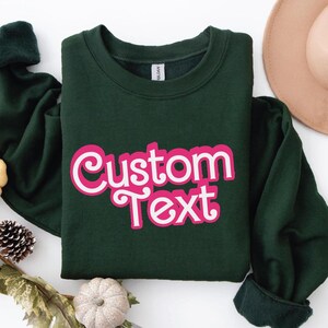 a green shirt that says custom text on it