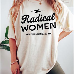 a woman wearing a t - shirt that says radical women