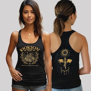 A woman wearing a black tank top with a graphic design on the front and a dragon design on the back.