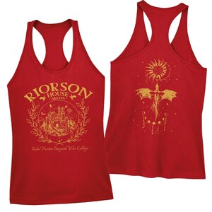 a red tank top with gold text and graphics.